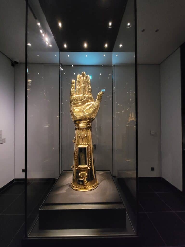 Golden arm reliquary containing the forearm of Charlemagne in the cathedral in Aachen. The wrapped bone can be seen through a small window above the wrist