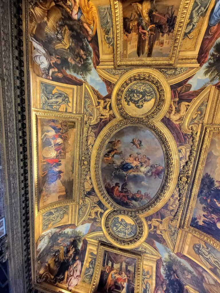 A gilded painted ceiling in Versailles