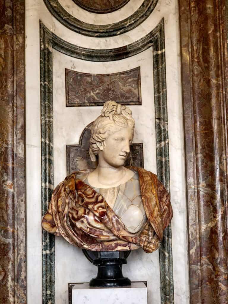 Bust of a woman using many different kinds of marble