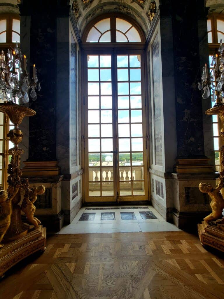 A view out to the gardens from the Hall of Mirrors in Versailles