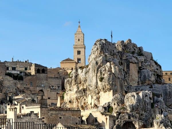 Two churches in Matera Italy, one made of sandstone blocks and the other carved into the rock