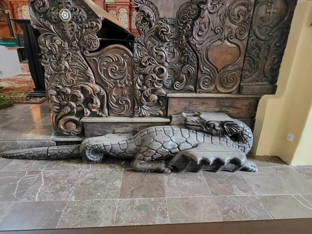 A small grey carved stone dragon