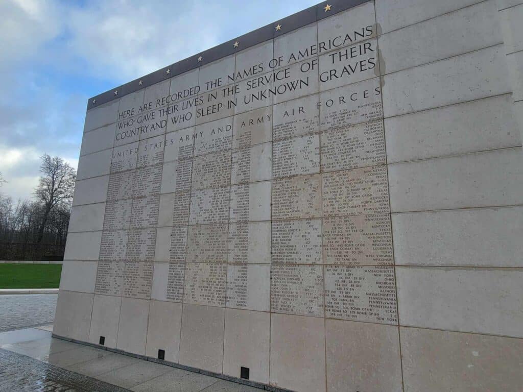 A large granite slab with names carved on it