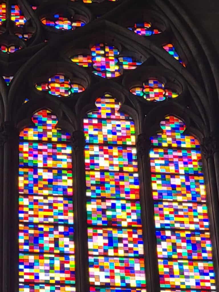 A colorful and pixelated stained glass window by Gerhardt Richter