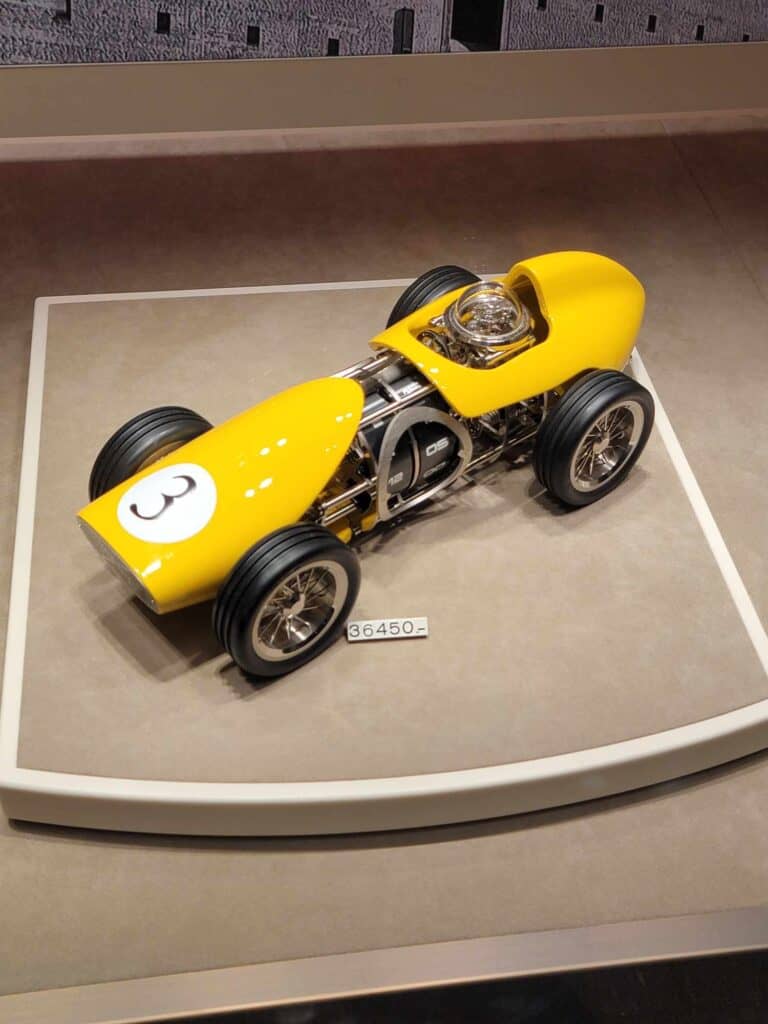 A table clock that looks like a yellow Italian race car with a price of 36,450 euros