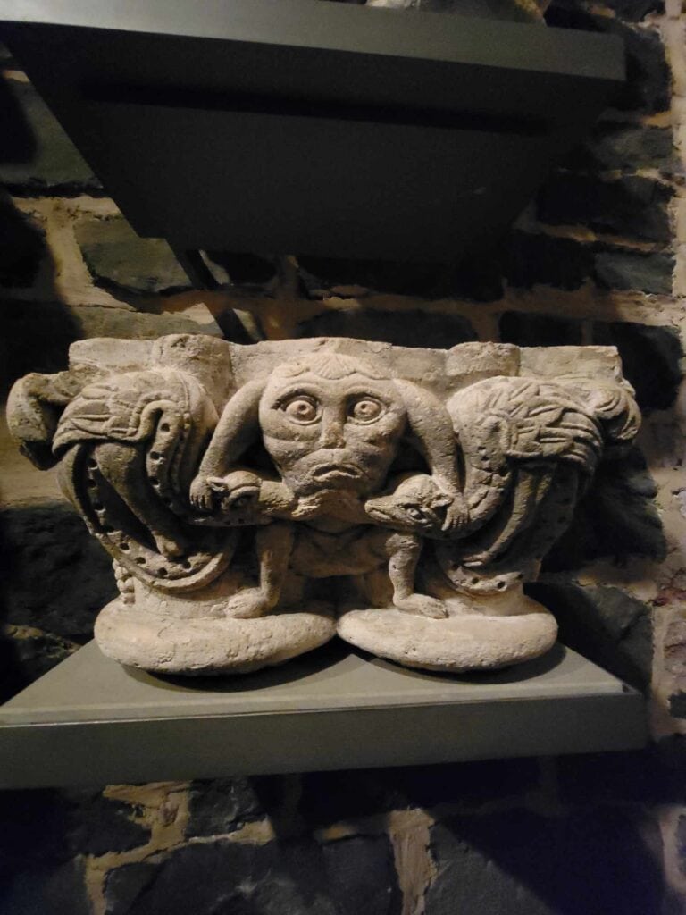 A medieval capital  in Cologne Cathedral's treasury with squatting gargoyle type figures