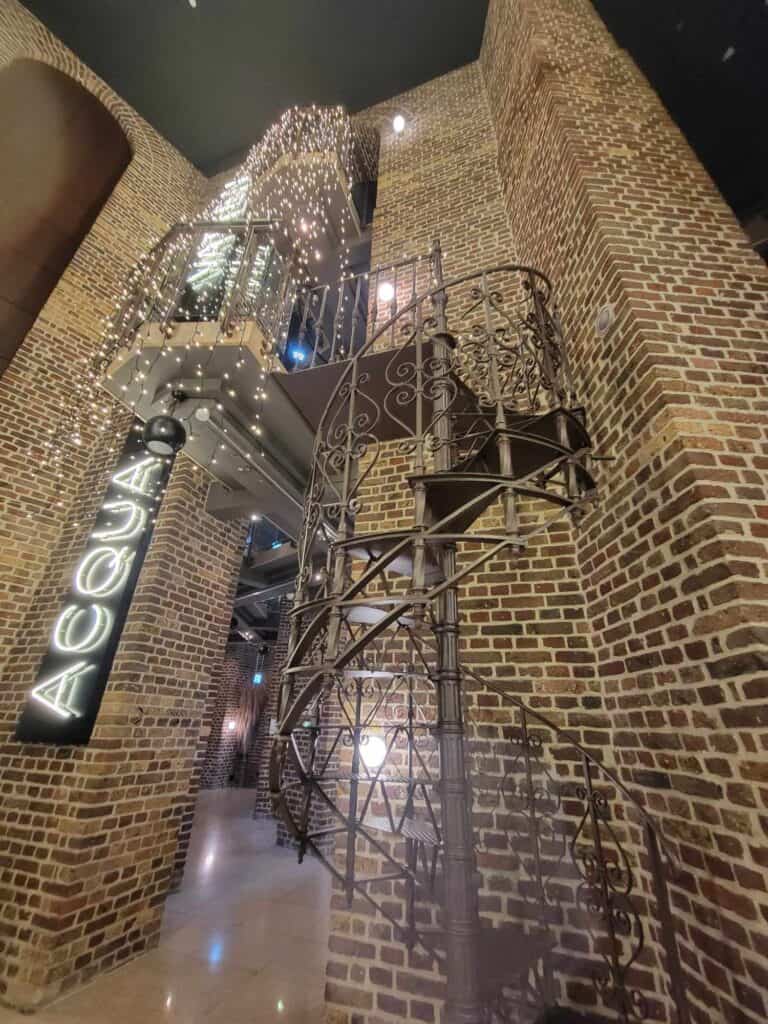 The tall brick reception area of the Waserturm Hotel in Cologne