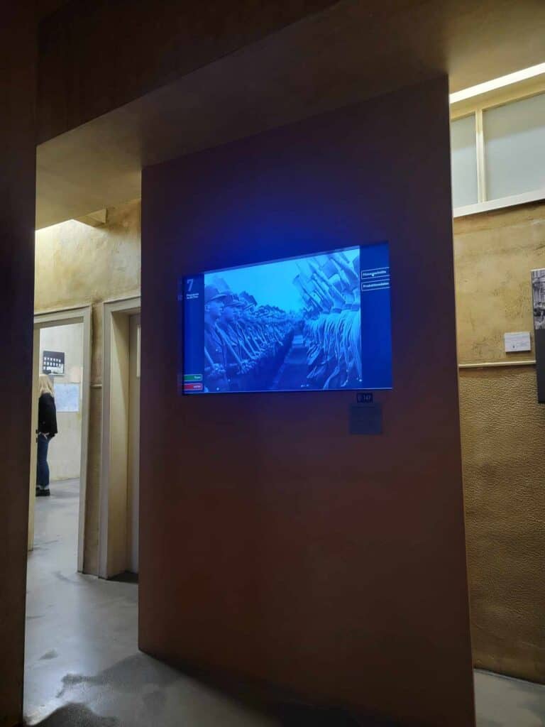 A screen showing rows of Nazi soldiers marching