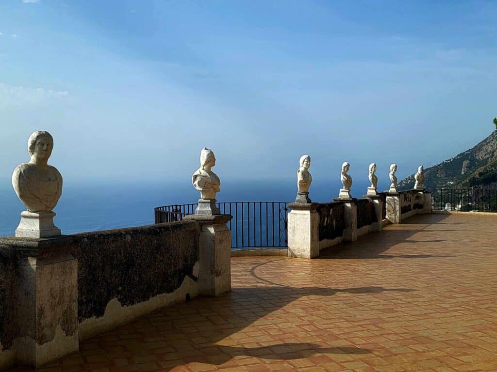 Of all the things to do in Ravello, make the terrace of infinity with its terra cotta tiles, marble busts, and great blue sky and ocean a must!