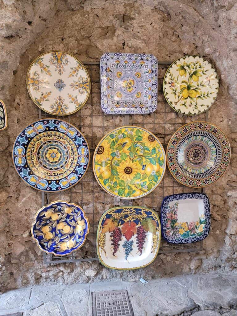 A variety of decorative ceramic platters in a gift shop in Ravello