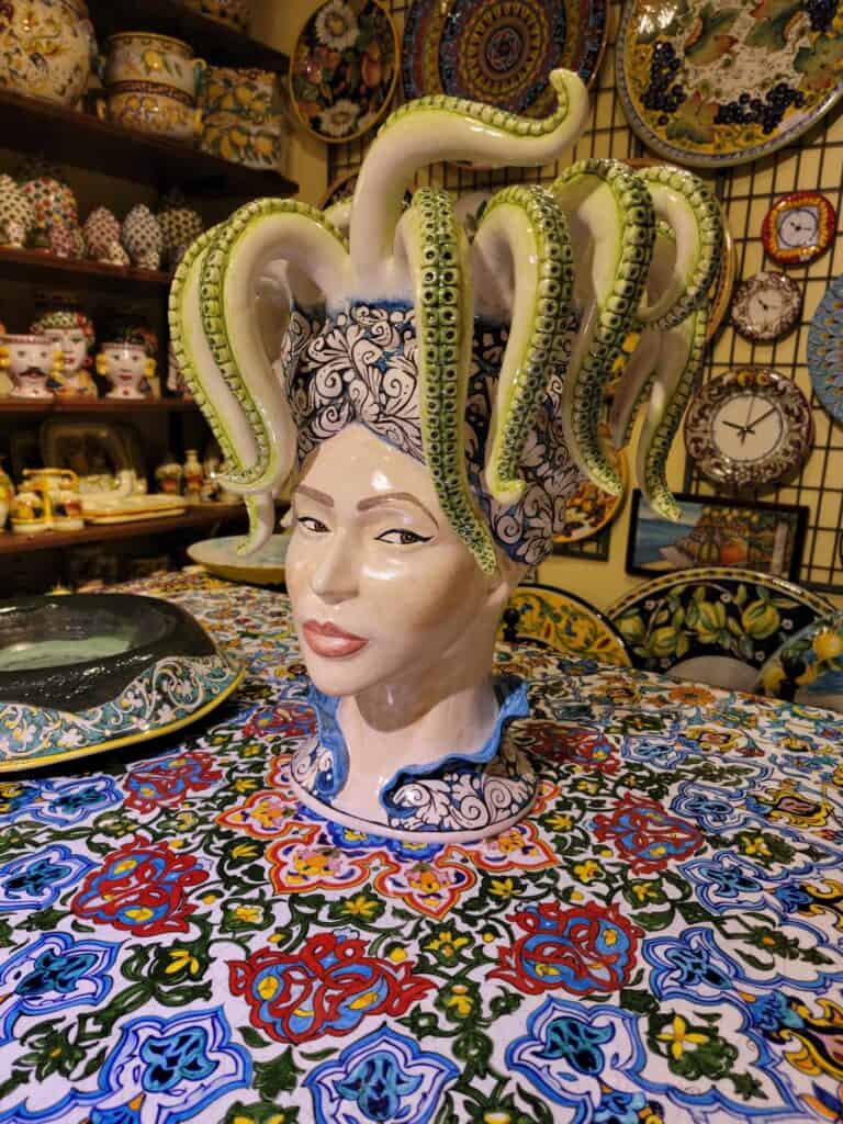 A ceramic Medusa figure with octopus tentacles in a gift shop in Ravello