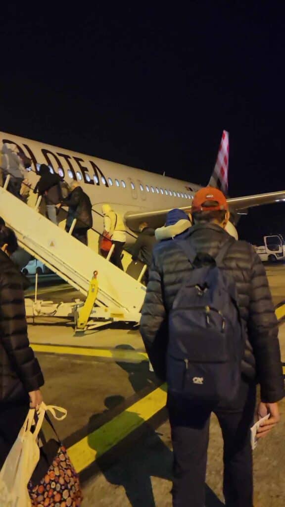 A Volotea aircraft, and passengers boarding on the tarmac