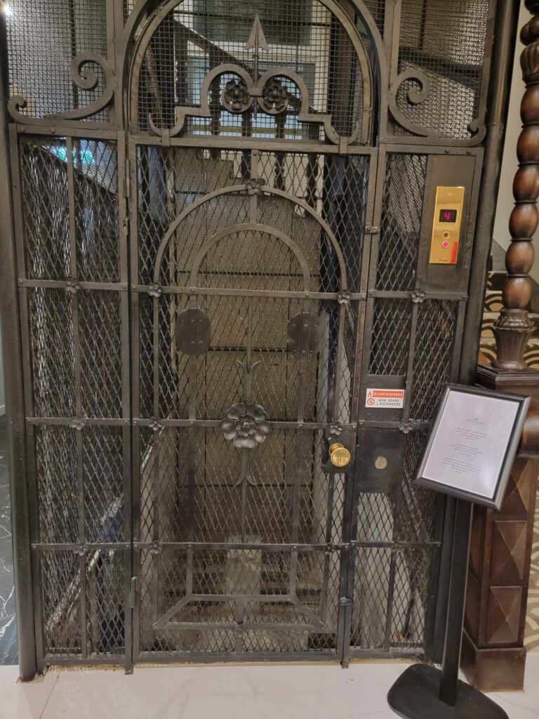 An iron grillwork surround for an old elevator in Hotel Astoria Genoa Italy
