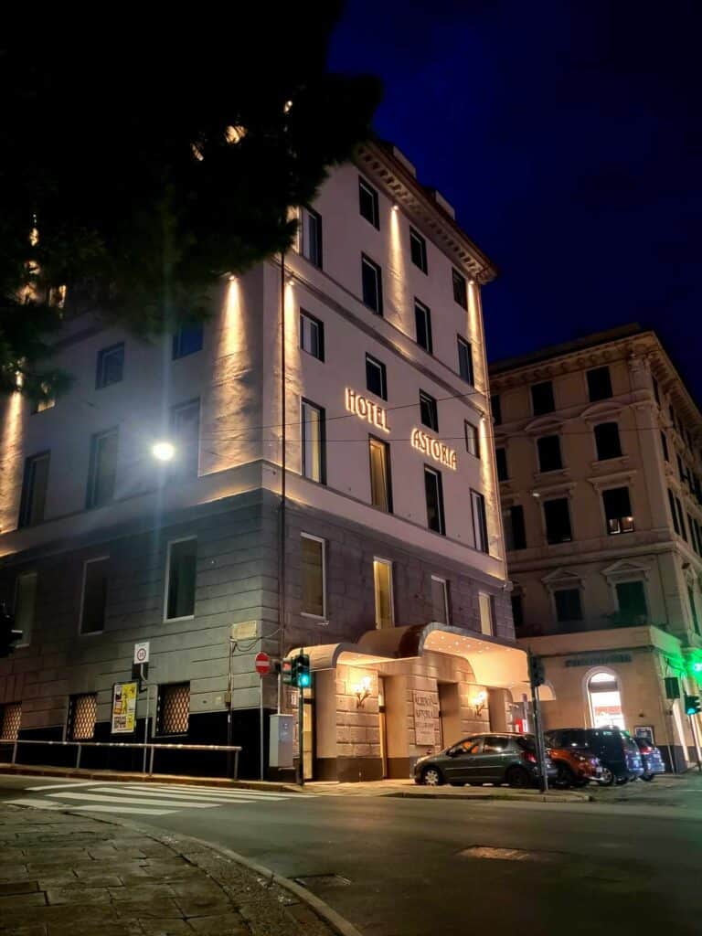 The facade of Hotel Astoria Genoa Italy at night