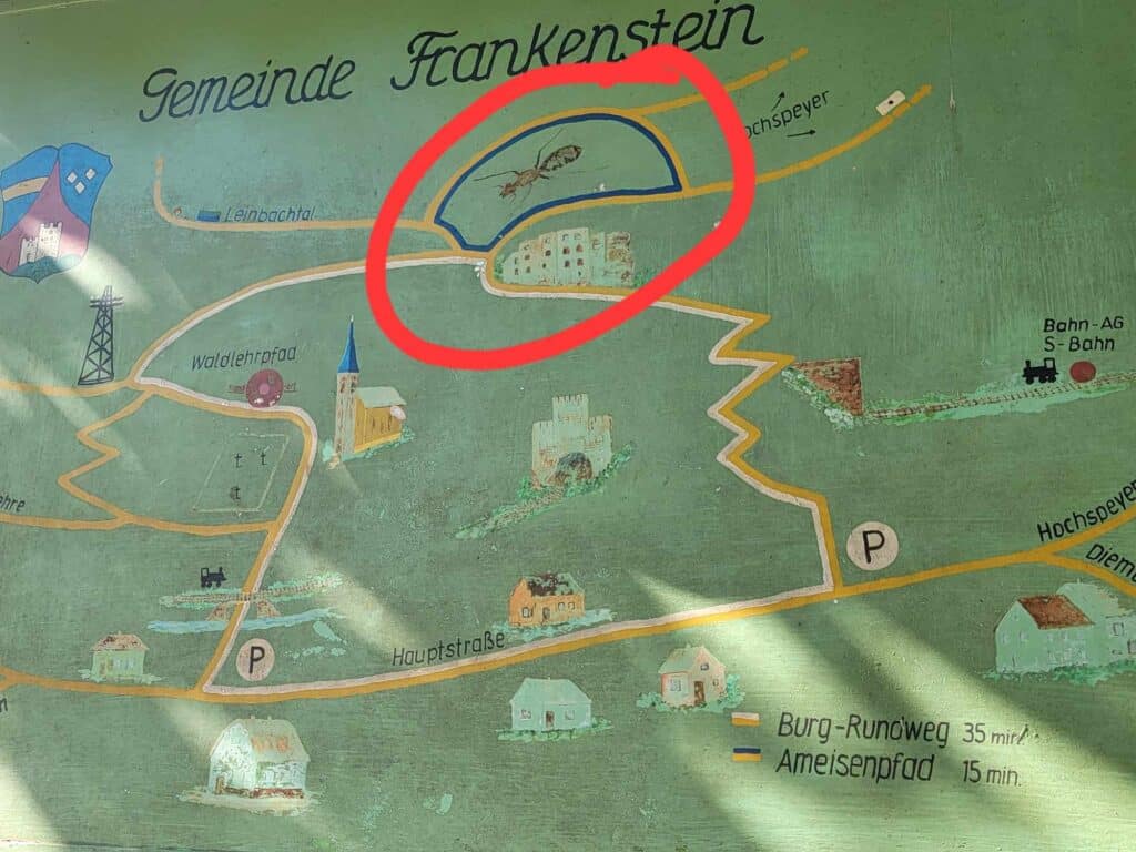 A graphic map depicting the community of Frankenstein showing the mail street, parking, the church, the train, the castle, and a giant ant. It has been circled in red by the photographer.