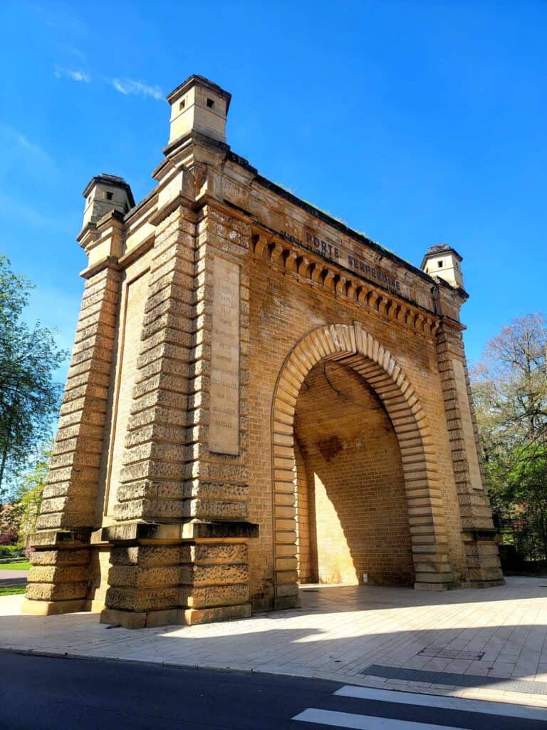 A large yellow stone ornamental arch