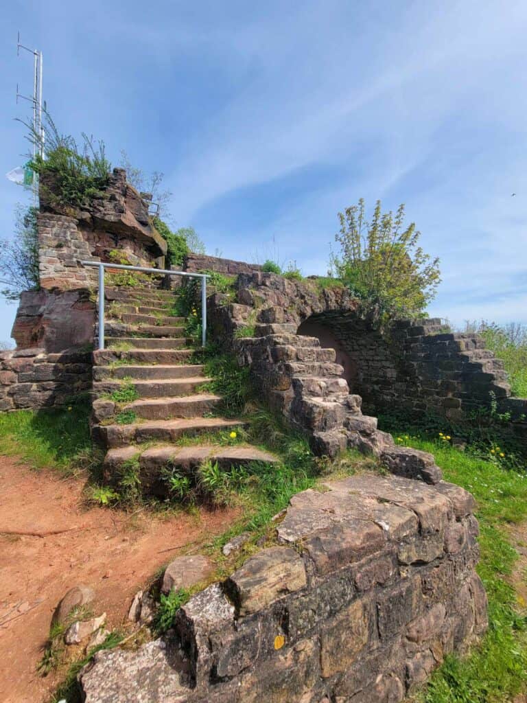 Castle ruins with stairs and arches