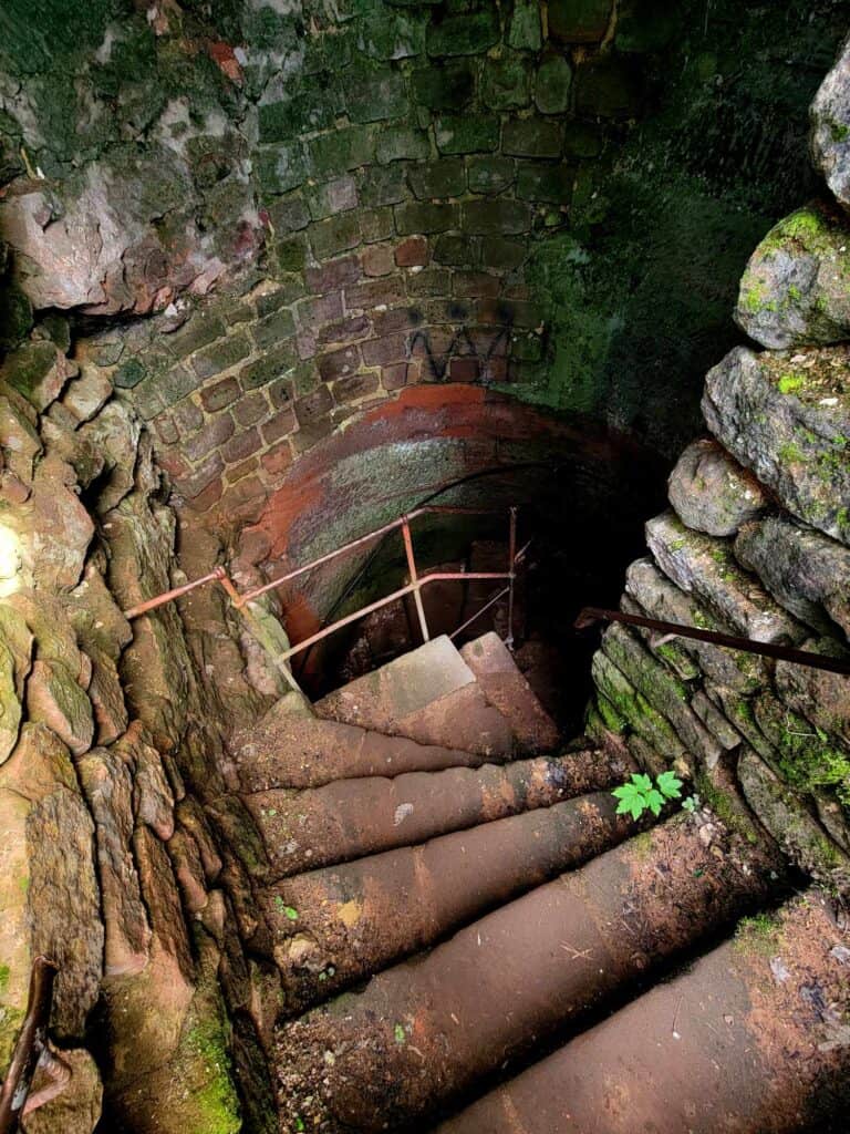 Steep steps going into a dark tunnel