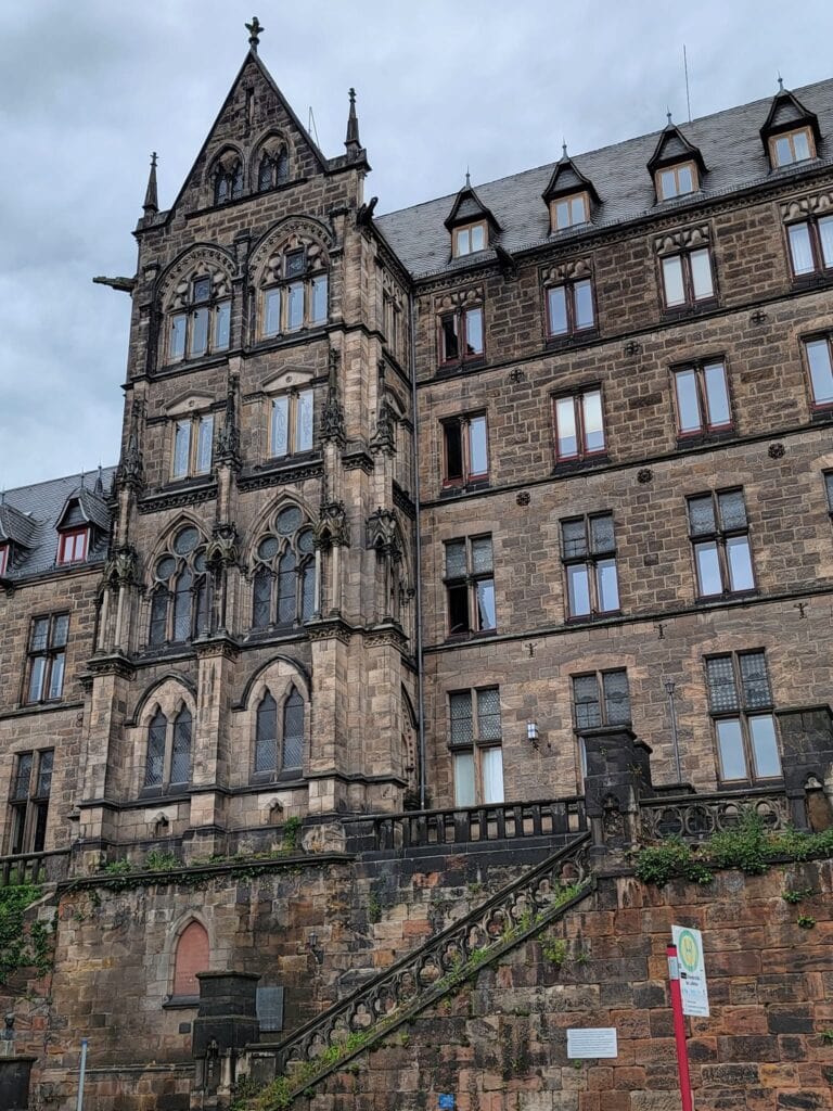 A stone building with many windows 