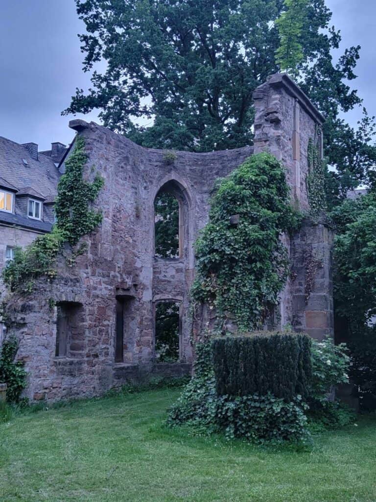 A stone ruin of a wall with window openings