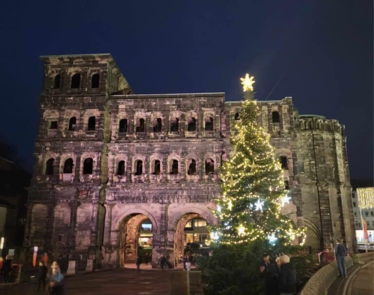 The Roman gate of Porta Nigra in Trier with an illuminated Christmas tree