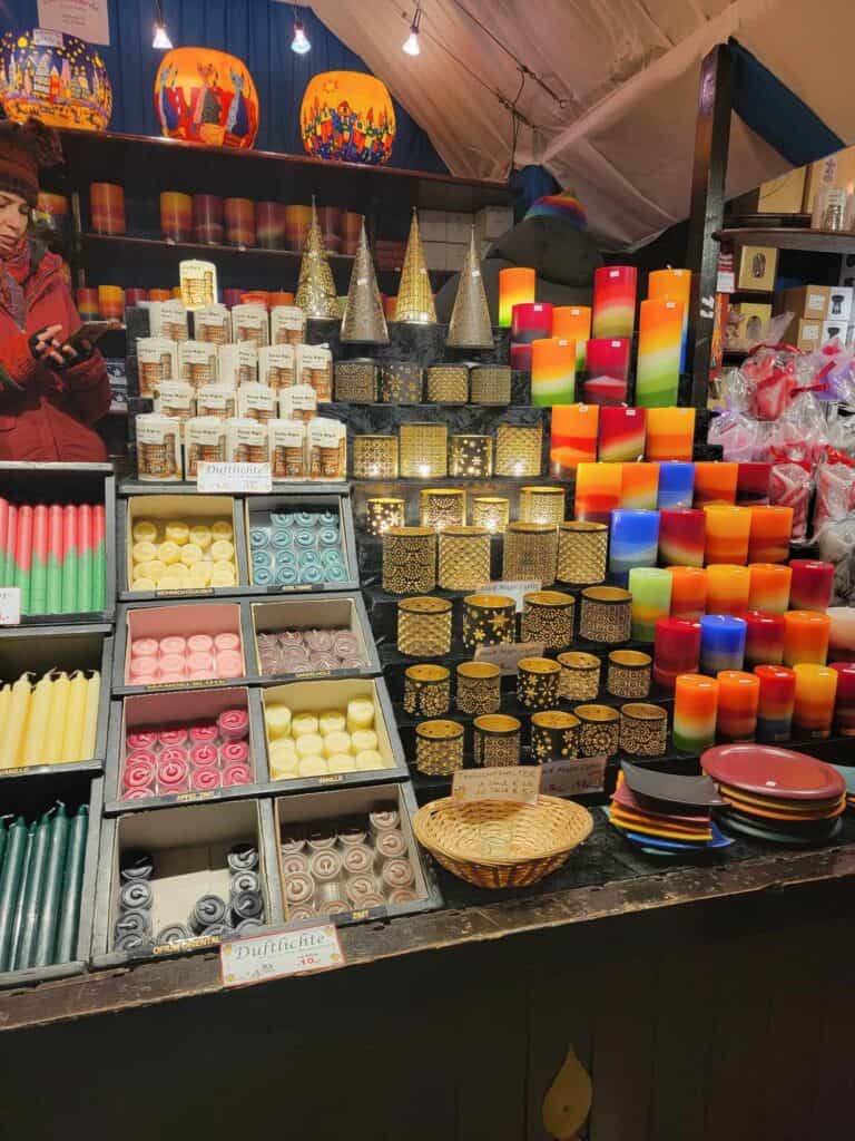 Stacked displays of pillar, taper, and votive candles in all colors