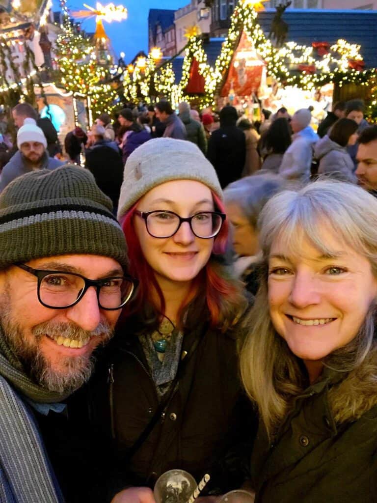 Three people enjoying the market in a smiling selfie