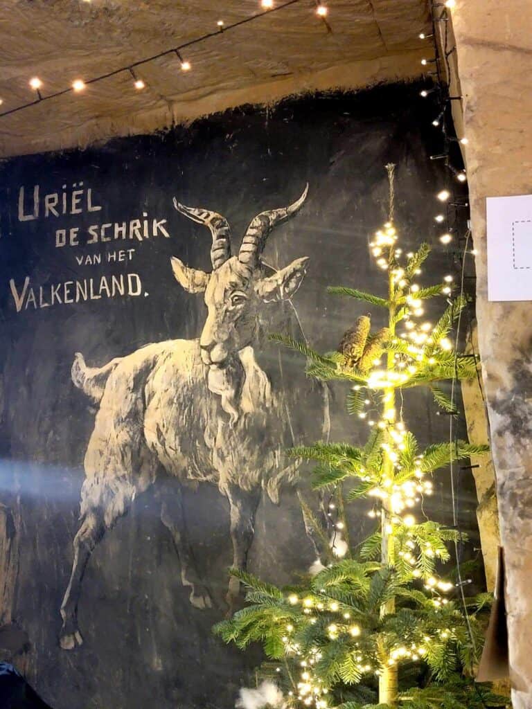 A painting of a goat on a cave wall