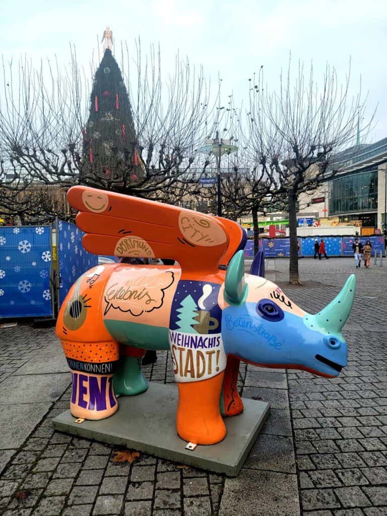 A flying rhino sculpture with patchwork design