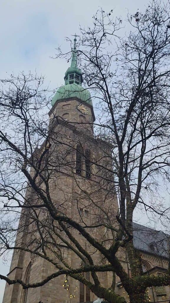 A church behind a winter tree