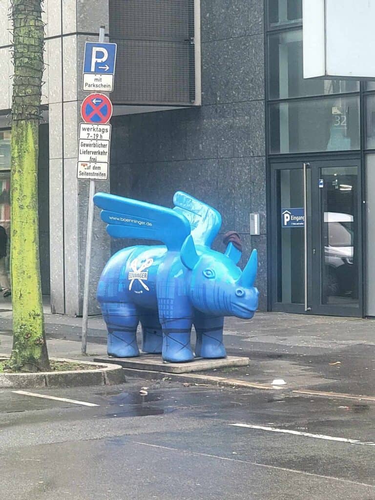 A blue flying rhino sculpture