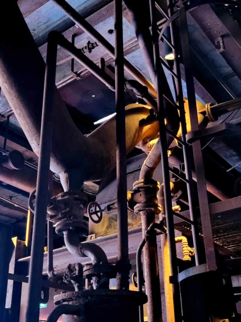 Pipes twisted in an indoor industrial space