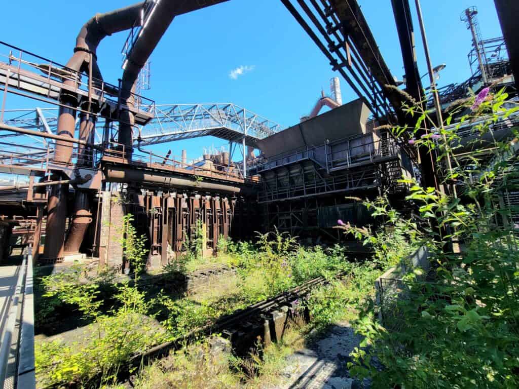 Völklingen ironworks from the outside with green plants encroaching