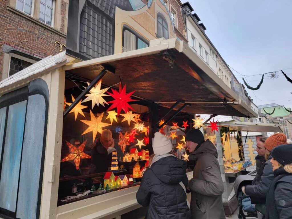 A market stall with illuminated paper stars