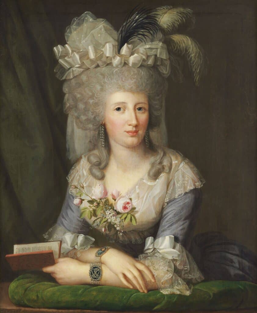 A woman in a blue silk dress with lace sleeves, bracelets, diamond earrings, a powdered wig and a hat with ribbons and feathers, with flowers tucked in her cleavage, holding a book