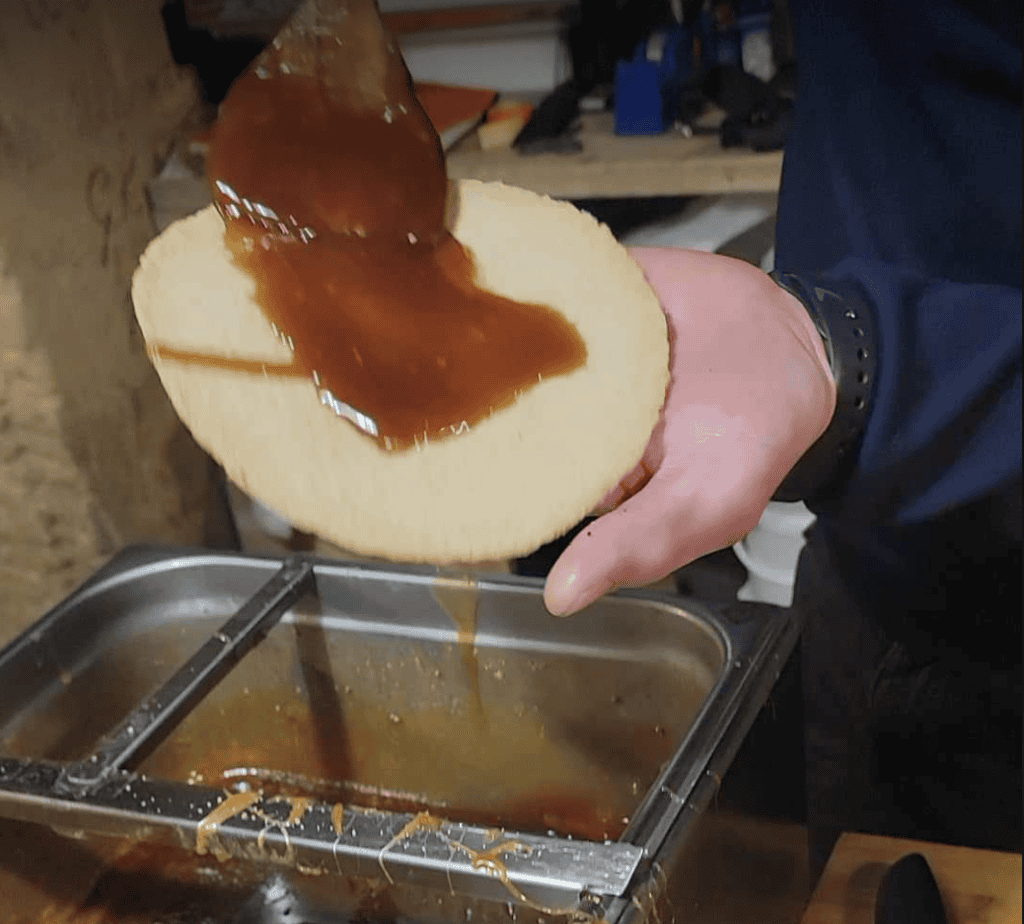 Caramel being drizzled on a stroopwaffel