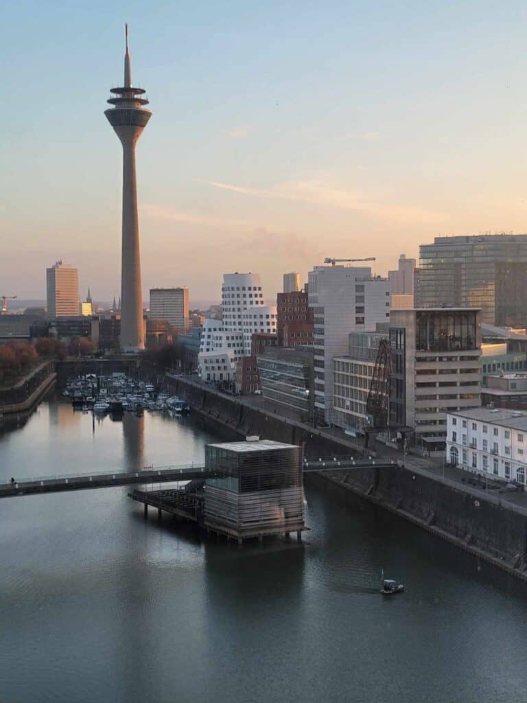 A stunning sunrise over the Rhine with the Dusseldors skyline and a bridge