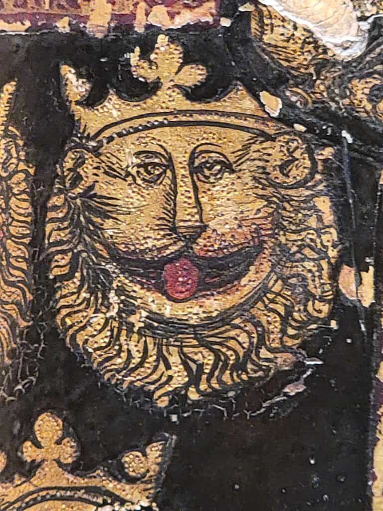 A painted gold medieval lion