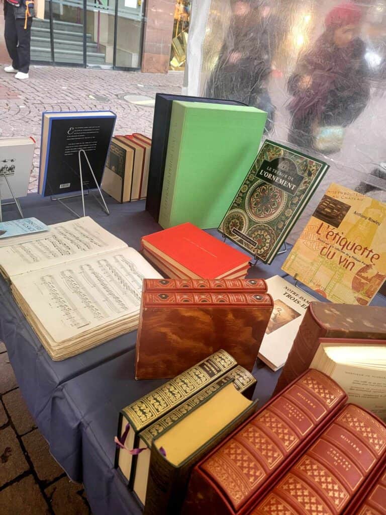 An assortment of old and antique books on a table