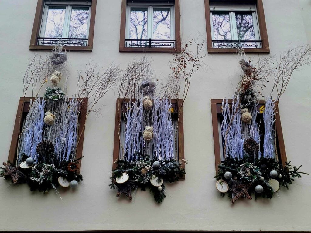 Decorated widows with snow covered twigs and owls