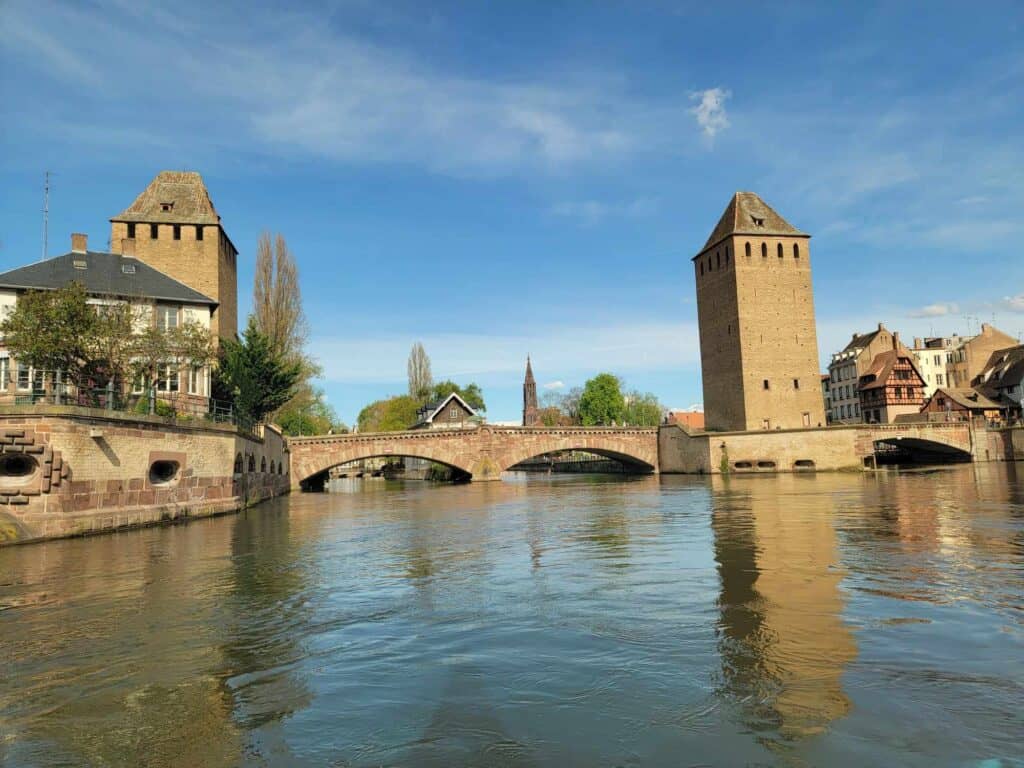 Two towers and a stone bridge over the River Ille