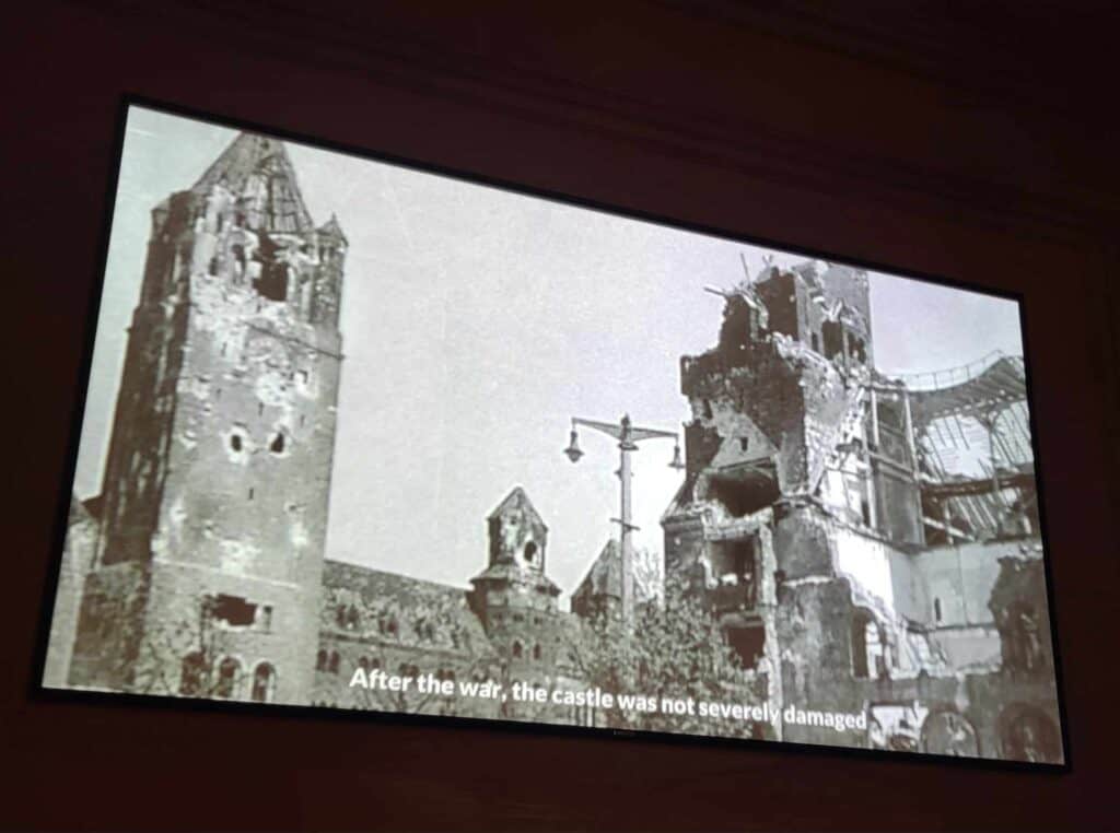 An old black and white photo of the Imperial Palace showing destruction from mortar fire during world war 1.