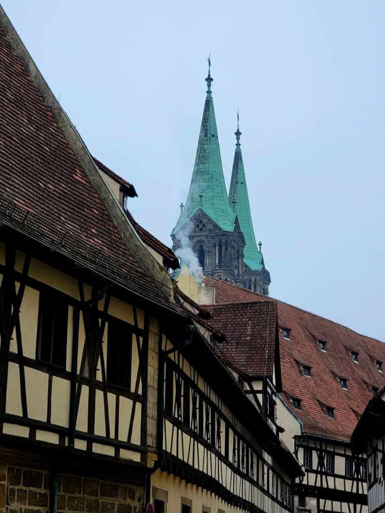 Half timbered buildings with two spires overhead