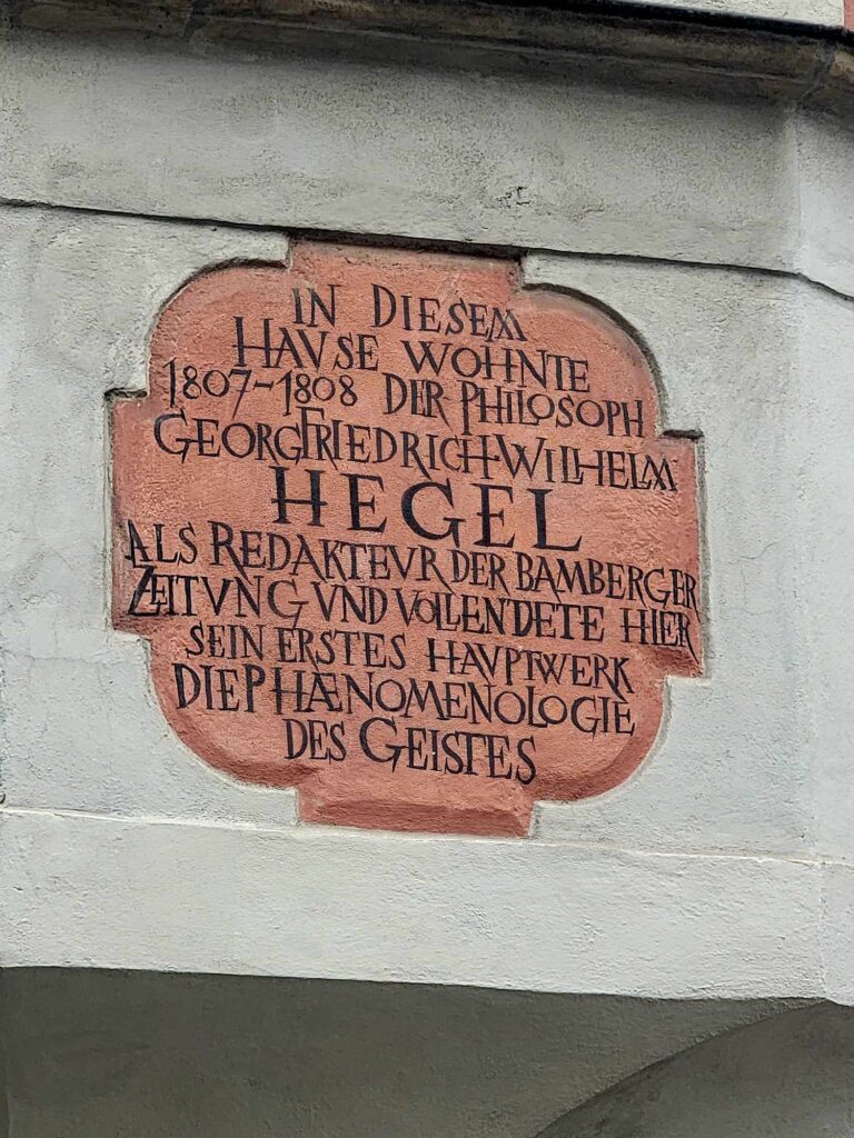 A stone plaque with lettering saying in this house the philosopher Georg Friedrich Wilhelm Hegel lived 1807-1808