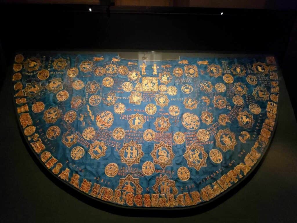 A large blue silk mantle with gold embroidery