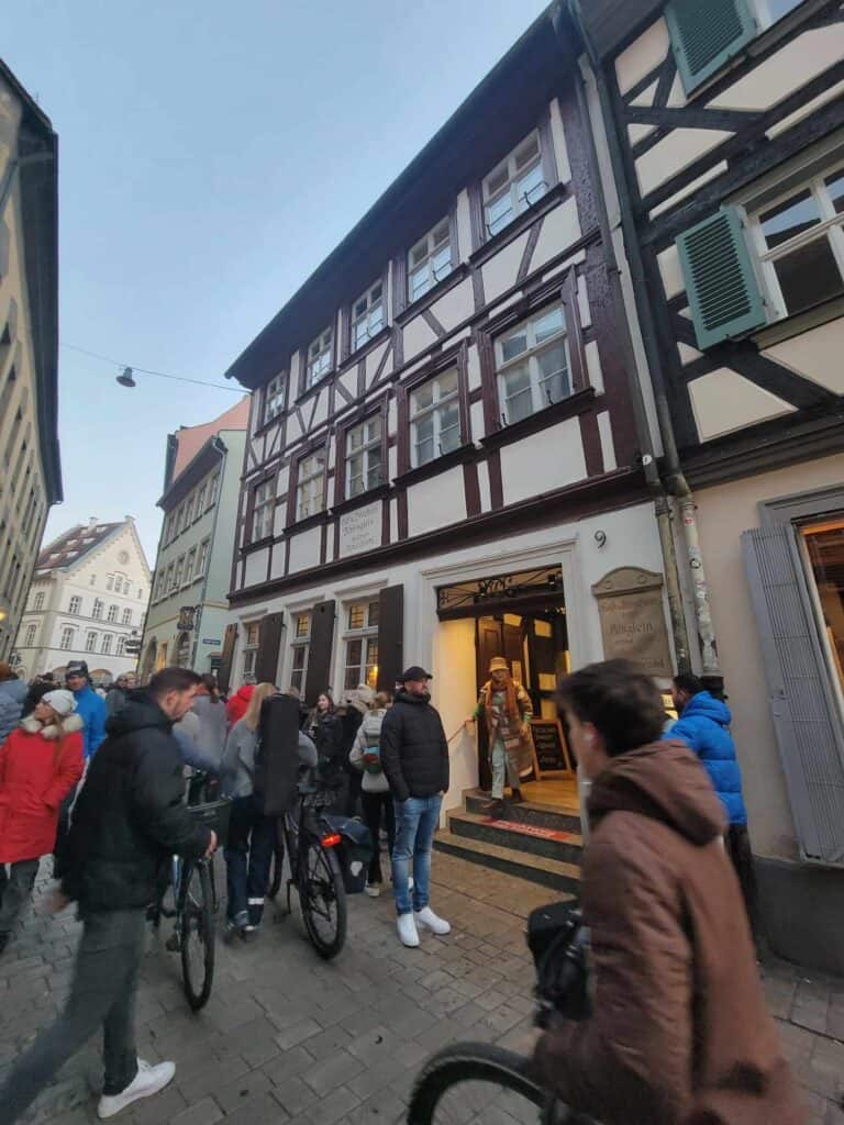 A street with people and half timbered houses