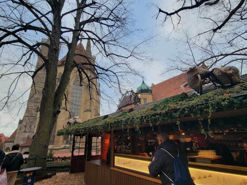 A market stall with a church behind