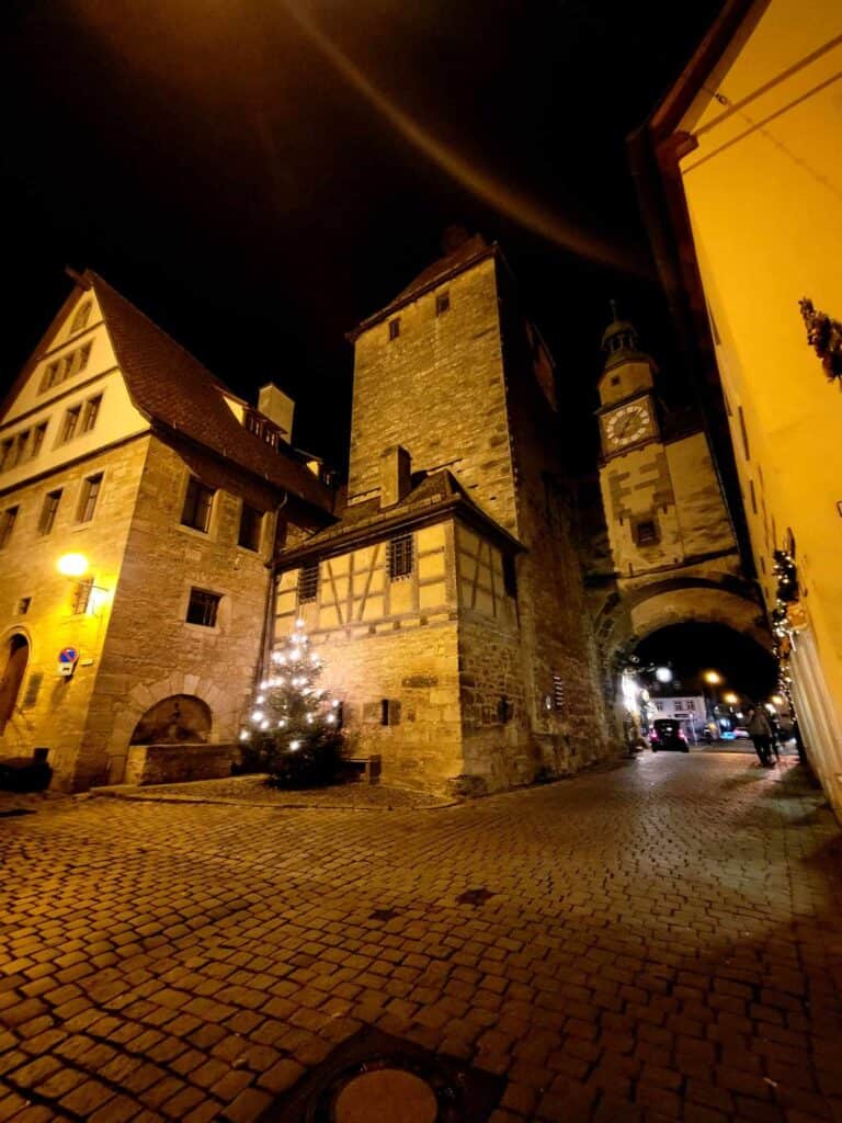 An old medieval gate complex including tower, archway, and clock