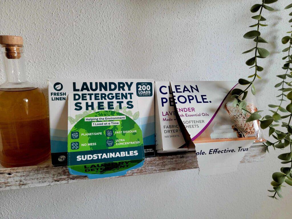 Two boxes of laundry sheets on a shelf