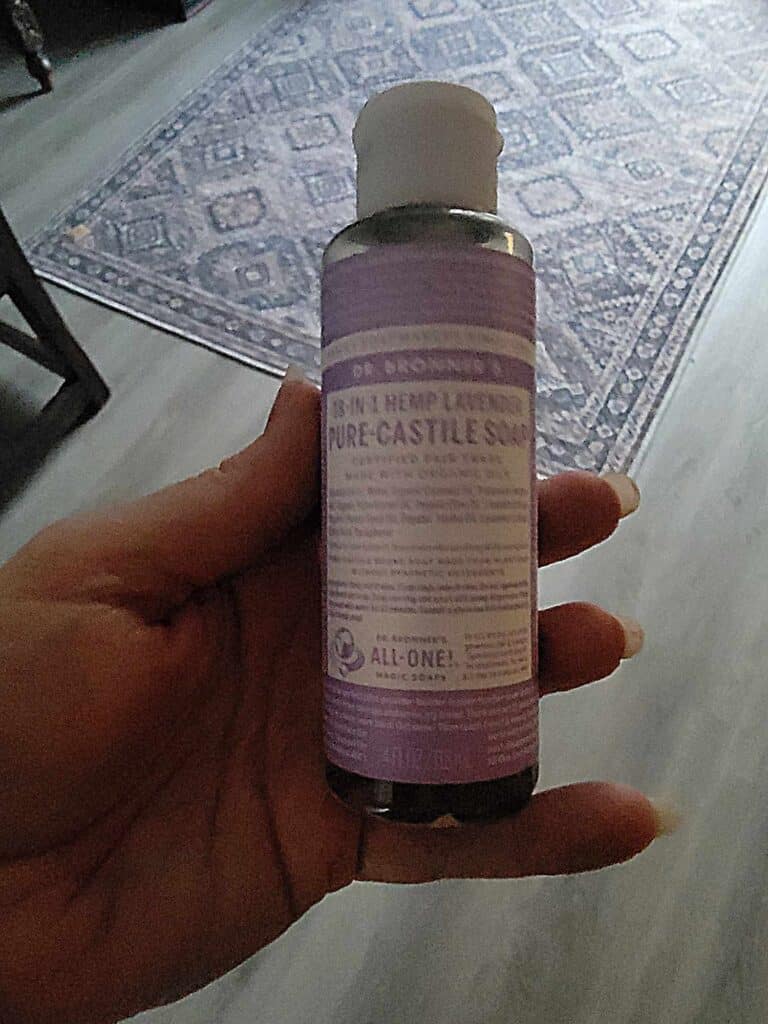 A small container of Dr. Bronner's Castille soap liquid in lavender